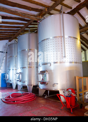 Stainless steel fermentation tanks vessels indoor of mediterranean winery Stock Photo