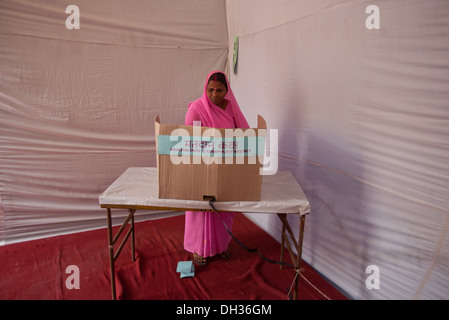 Indian woman voting at election polling station Mumbai Maharashtra India Asia Oct 2009 Stock Photo