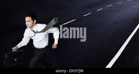 Businessman running on the road Stock Photo