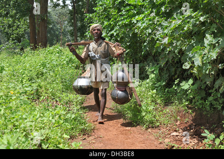 Baiga man carrying mahua. Baiga Tribe, Chada village, Madhya Pradesh, India Stock Photo