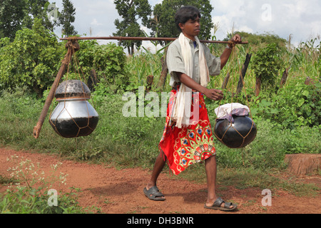 Baiga boy carrying mahua. Baiga Tribe, Chada village, Madhya Pradesh, India Stock Photo