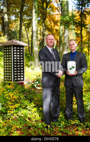 Saarbruecken, Germany. 22nd Oct, 2013. The undertakers Hubert Laubach (L) and Hubert Marc Laubach stand in the area for forest burials of the main cemetery in Saarbruecken, Germany, 22 October 2013. The two undertakers found voluntary mourners for decendents without relatives. Photo: Oliver Dietze/dpa/Alamy Live News Stock Photo