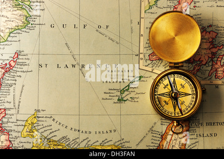 Antique compass over old XIX century map Stock Photo