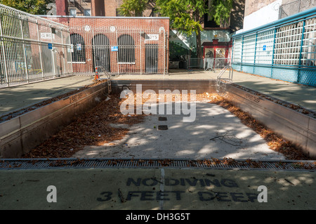 New York, 26 Oct 2012 - Empty public Swimming pool with in autumn leaves and debris in the Soho neighborhood of Manhattan Stock Photo