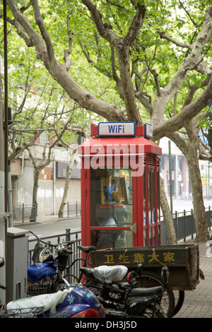 China Shanghai red telephone box with Wi-Fi connection sign Stock Photo