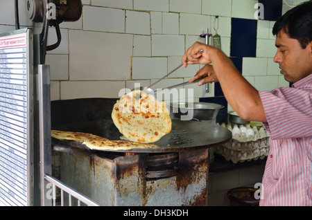 Indian man making roll, Kolkata, India Stock Photo