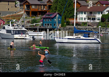 Water activities in front of the Tides Tavern Gig Harbor Washington Stock Photo