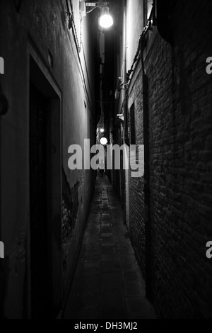A narrow alley with a street light in Venice, black and white, UNESCO World Heritage Site, Venice, Veneto, Italy, Europe Stock Photo