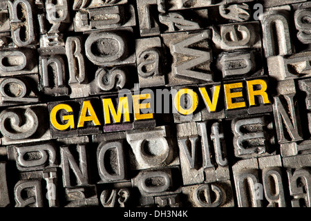 Old lead letters forming the words 'GAME OVER' Stock Photo