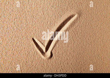 Tick, drawn in sand Stock Photo