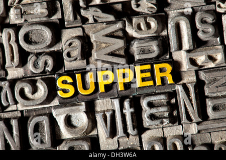 Old lead letters forming the word "SUPPER" Stock Photo