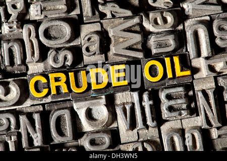 Old lead letters forming the words Crude Oil Stock Photo