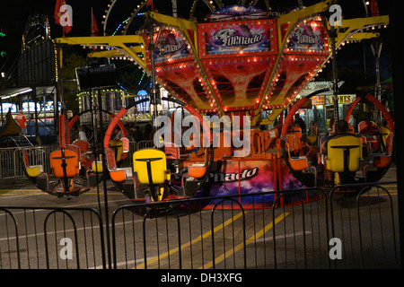 Carnival rides at night Stock Photo - Alamy