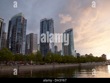 Towering steel and glass residential condos at Coal Harbour in downtown Vancouver, British Columbia, Canada at sunset. Stock Photo