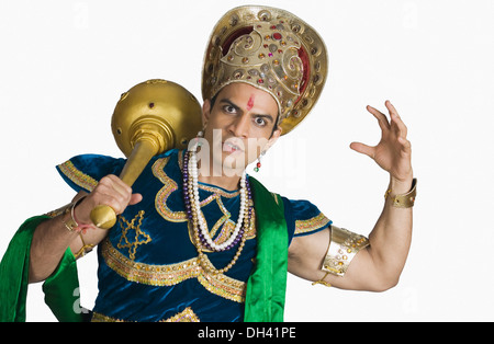 Young man dressed-up as Bhima and holding a mace Stock Photo
