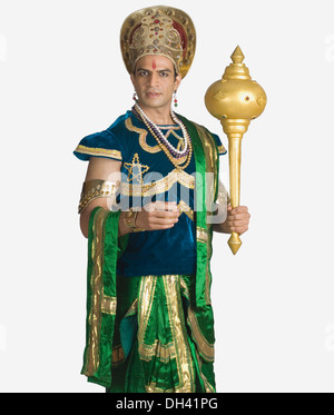 Young man dressed-up as Bhima and holding a mace Stock Photo