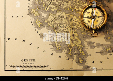 Antique compass over old XIX century map Stock Photo