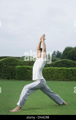 Side profile of a man exercising in a park Stock Photo