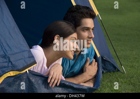 Couple lying in a tent Stock Photo