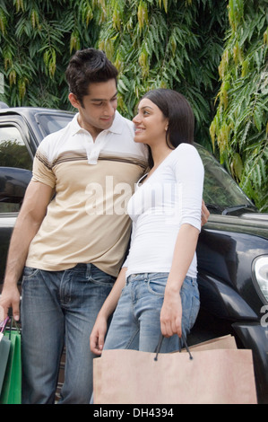 Couple carrying shopping bags Stock Photo