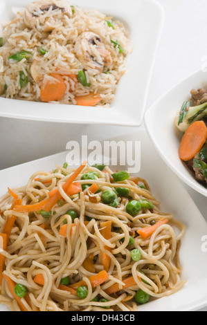 Close-up of noodles and fried rice in bowls Stock Photo