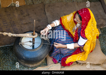 Woman churning butter milk, Jodhpur, Rajasthan, India - Model Release#786 Stock Photo