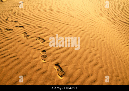 Marks of human feet on desert sand dunes Rajasthan India Asia Stock Photo