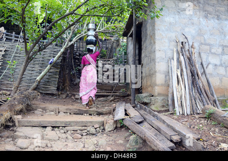 tribal woman carrying water pots at Rajahmundry Andra Pradesh India Stock Photo