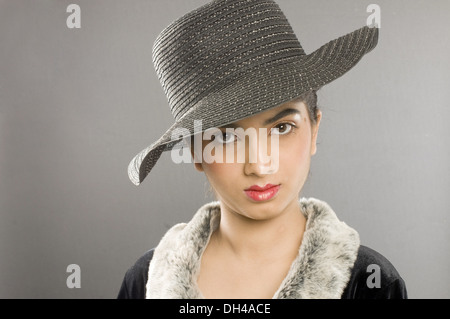 woman in fur collar coat and hat Pune Maharashtra India Asia MR#191 April 2012 Stock Photo