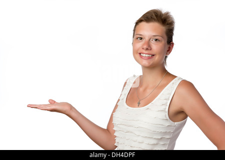 Young pretty woman on white background presenting something Stock Photo
