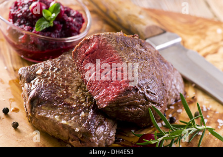 beef steaks on the wooden board Stock Photo