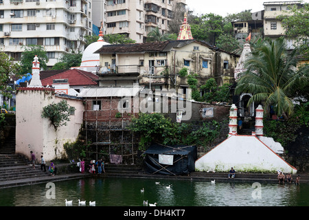 temple old houses new buildings Banganga Tank Walkeshwar temple Mumbai Maharashtra India Asia Stock Photo