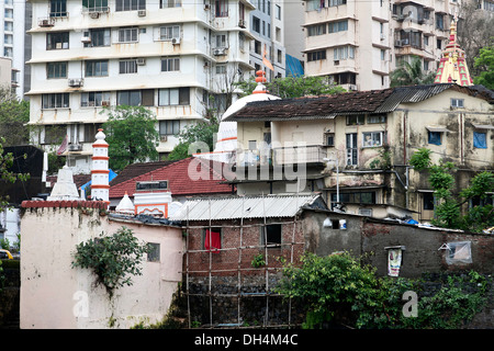 temple old houses and new buildings Banganga Tank Walkeshwar temple Mumbai Maharashtra India 2012 Stock Photo