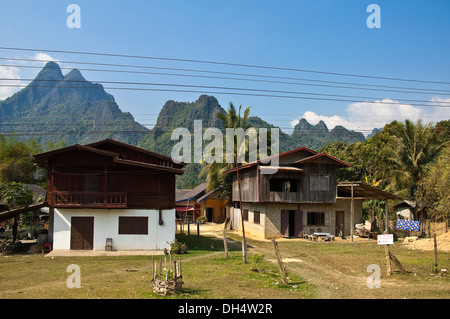 Horizontal view of typical new houses along a countryside street in Laos. Stock Photo