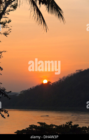 Vertical view across the Mekong river at sunset. Stock Photo