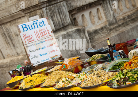 Horizontal close up of a popular 'all you can eat' buffet at the side of the road in Laos. Stock Photo
