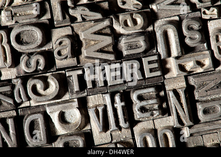 Old lead letters forming the word THERE Stock Photo
