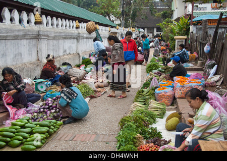 Horizontal streetscape of the daily fruit and vegetable market in Luang Prabang. Stock Photo
