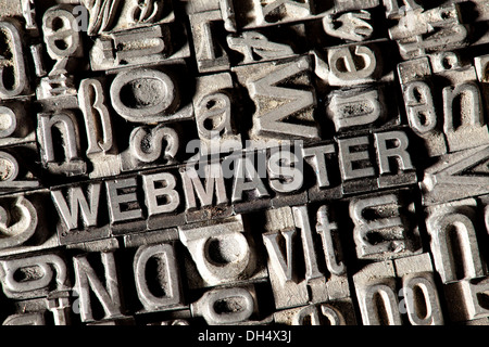 Old lead letters forming the word WEBMASTER Stock Photo