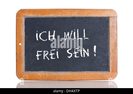 Old school blackboard with the words ICH WILL FREI SEIN!, German for I want to be free! Stock Photo