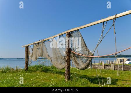 sea fishing nets hanging on rusty metal on an irish pier/quay side