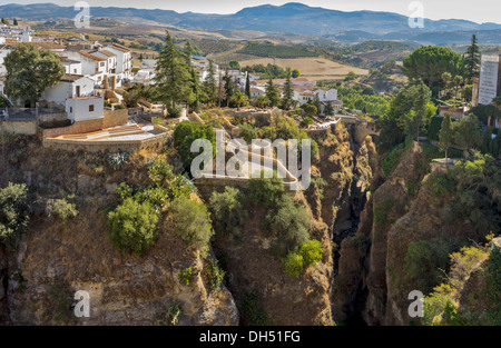 EL TAJO CANYON IN RONDA LOOKING TOWARDS THE ARAB BRIDGE [ PUENTE VIEJO]  ANDALUCIA SPAIN Stock Photo