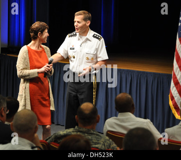 Lt. Gen. Jeffrey Talley, Chief of Army Reserve and Commanding General of US Army Reserve Command, passes the microphone to his wife Linda during a town hall meeting today at the Pentagon. Mrs. Talley urged the audience to recognize the families and friend Stock Photo