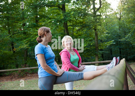 Women stretching on an outdoor fitness trail Stock Photo