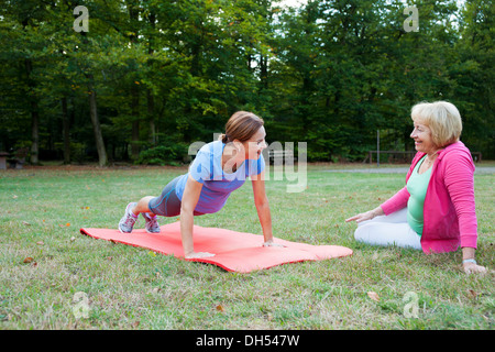 Women doing gymnastics outdoors Stock Photo