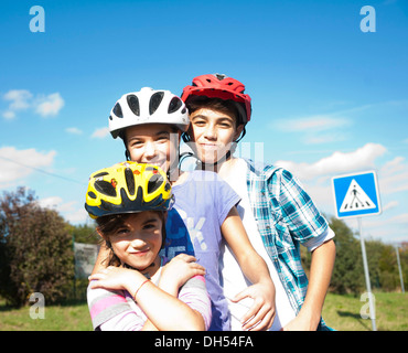 Children wearing bike helmets at a traffic awareness course Stock Photo
