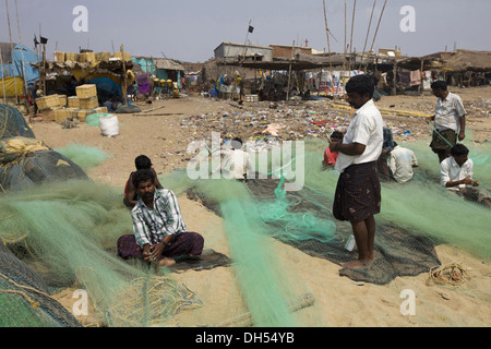 Fishermen making fishing nets, Orissa, India Stock Photo