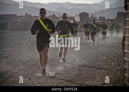 PAKTYA PROVINCE, Afghanistan – Dust flies from the feet of U.S. Army Soldiers with 1st Battalion, 506th Infantry Regiment, 4th Brigade Combat Team, 101st Airborne Division (Air Assault), as they conduct a Run for the Fallen, at Forward Operating Base Gard Stock Photo