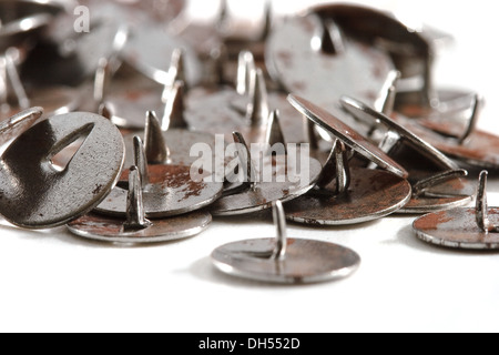 Old rusty push-pins Stock Photo