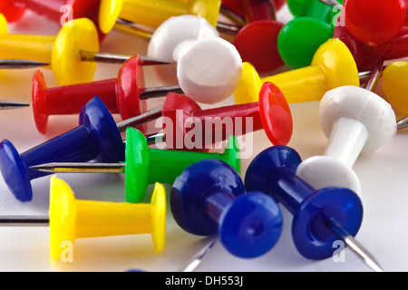 Office pins on white paper Stock Photo